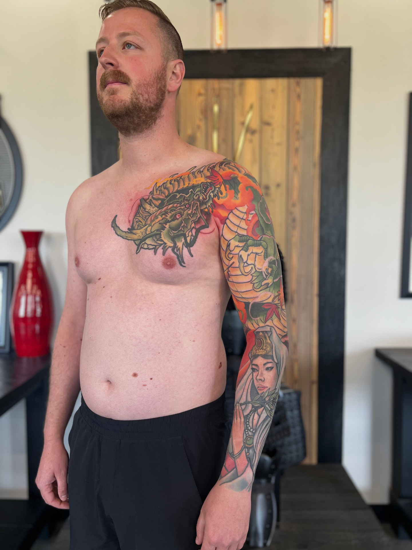 Japanese-inspired colorful sleeve tattoo by Crimson Empire Tattoo